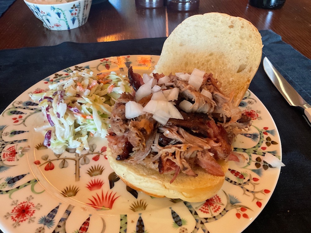 Pulled Pork Sandwich with Chopped White Onions and Ms. K's Homemade Coleslaw